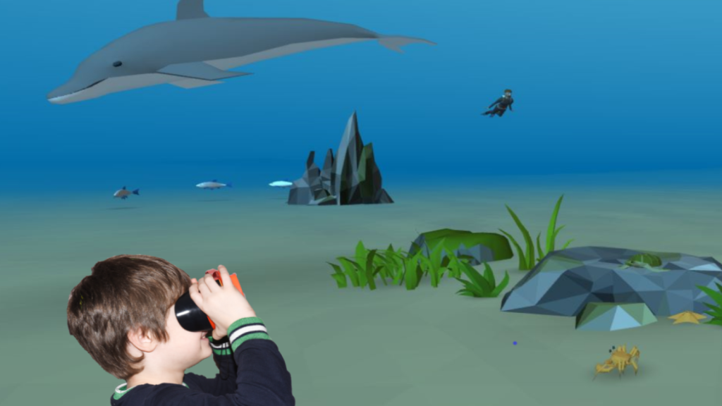 Ein Junge schaut sich seine 3D Unterwasserwelt an